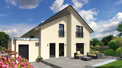 Fingerhut Einfamilienhaus schwarzes Pultdach hellgelb verputzt Terrasse Terrassenmöbel mit gelben Kissen 